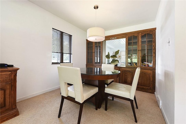 dining area featuring baseboards