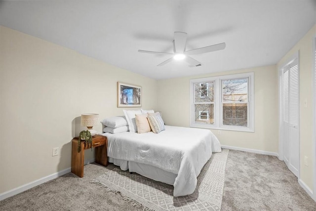 bedroom featuring ceiling fan and light colored carpet