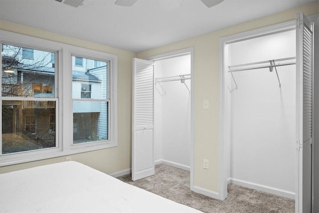 bedroom featuring light colored carpet