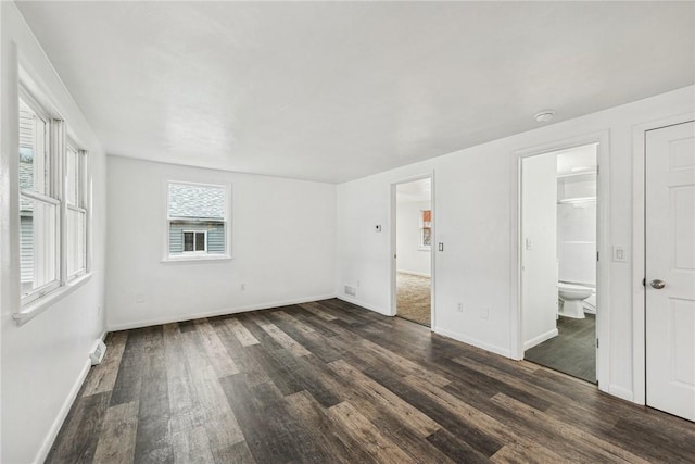 spare room featuring dark hardwood / wood-style floors