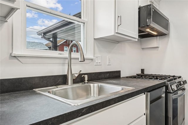 kitchen featuring white cabinetry, sink, and stainless steel appliances