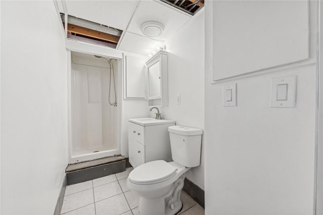 bathroom featuring tile patterned floors, vanity, toilet, and walk in shower