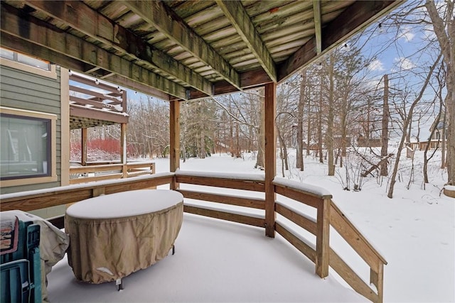 view of snow covered deck