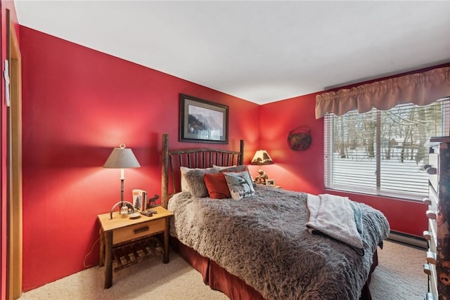 bedroom with carpet flooring and a baseboard radiator