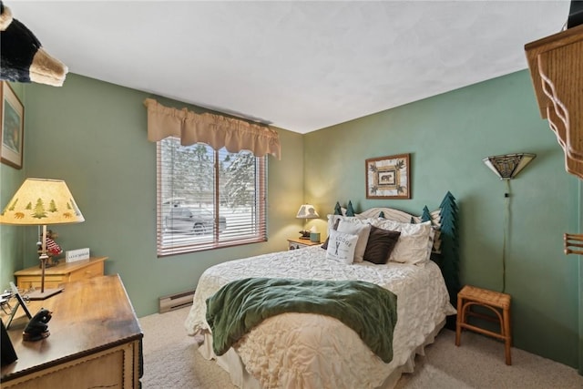 carpeted bedroom featuring a baseboard radiator