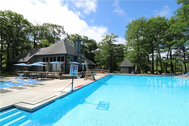 view of pool with a patio and a deck