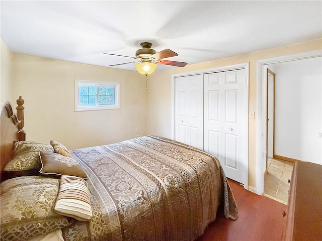 bedroom featuring ceiling fan, carpet floors, and a closet