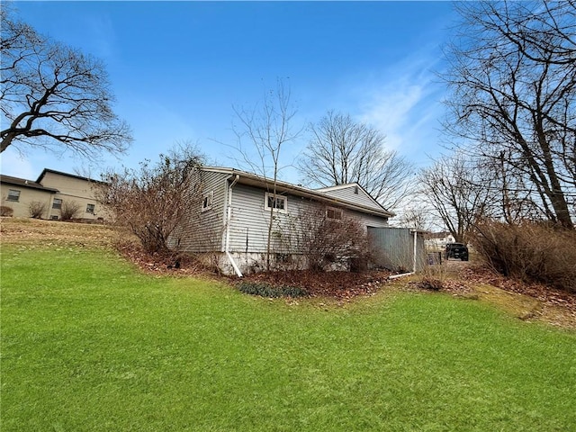 view of home's exterior featuring a lawn