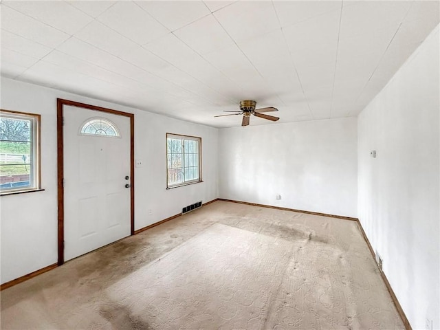 entrance foyer featuring plenty of natural light and ceiling fan