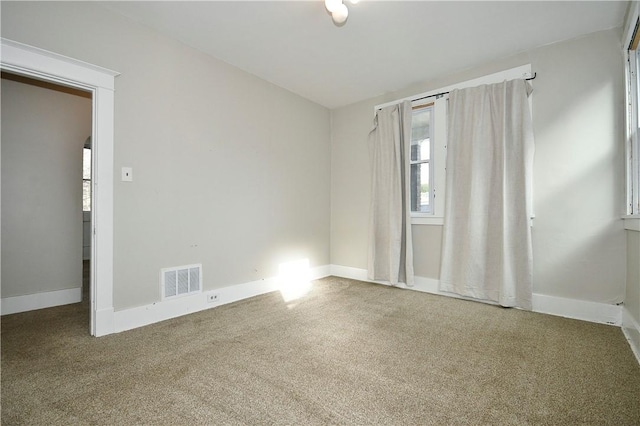 unfurnished room with carpet