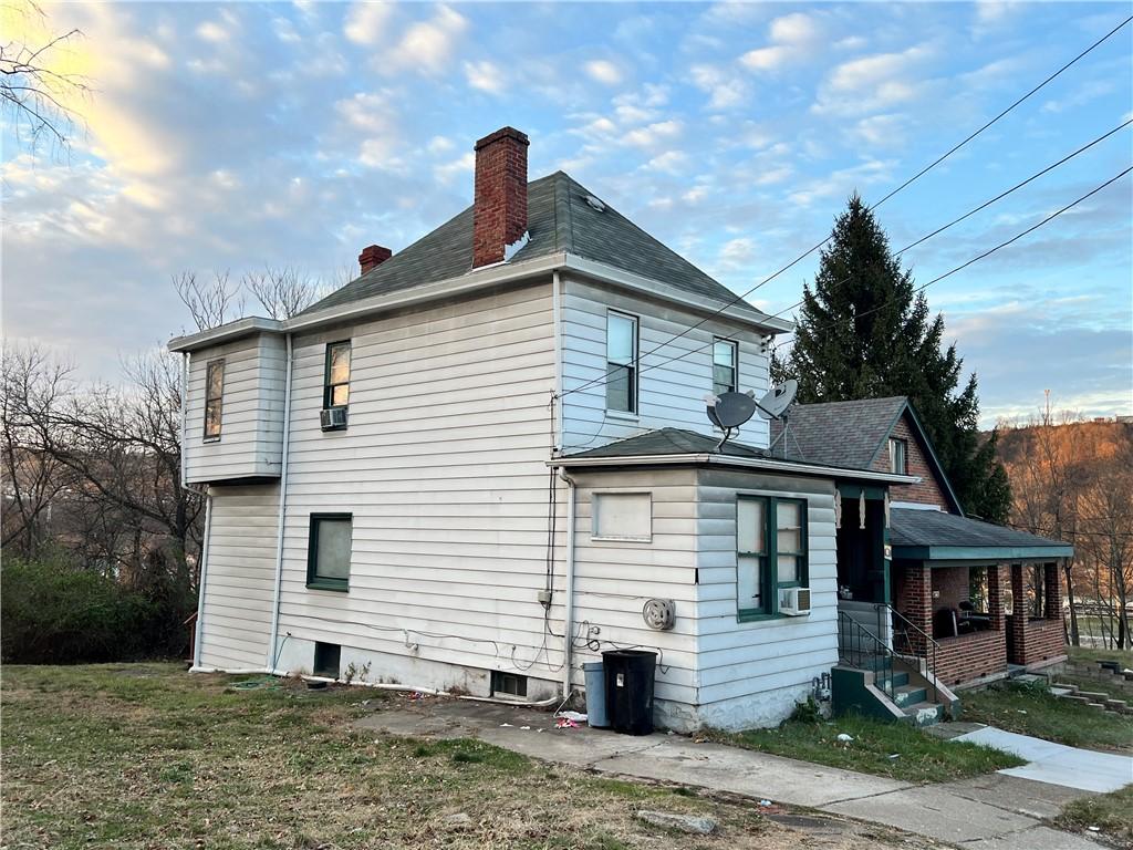 view of side of home with cooling unit