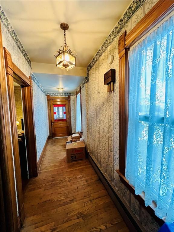 corridor featuring hardwood / wood-style floors