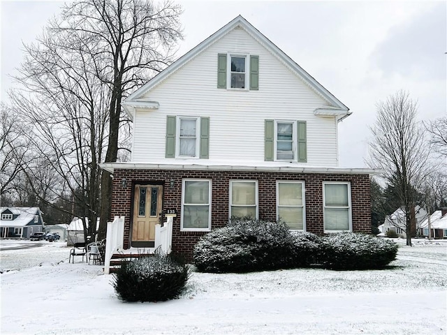 view of front of property featuring brick siding