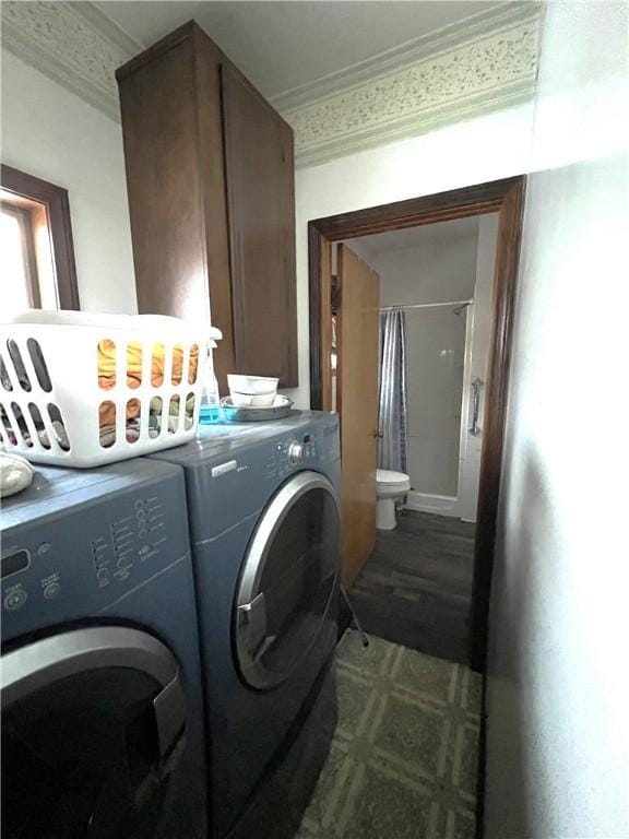 washroom with washer and dryer and crown molding