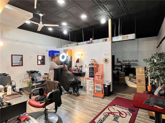 home office with hardwood / wood-style floors and ceiling fan