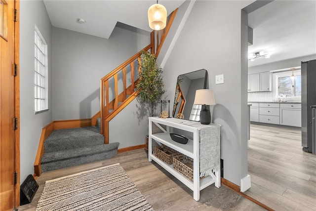 stairs featuring hardwood / wood-style flooring