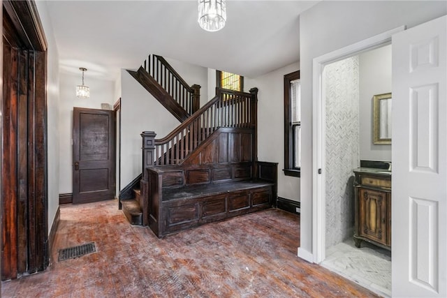 foyer featuring a notable chandelier