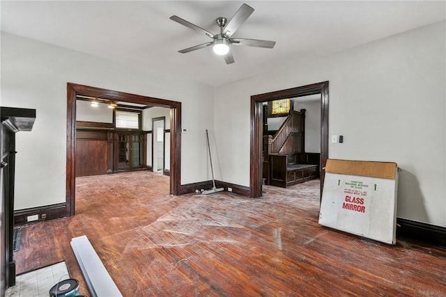 empty room with ceiling fan and wood-type flooring