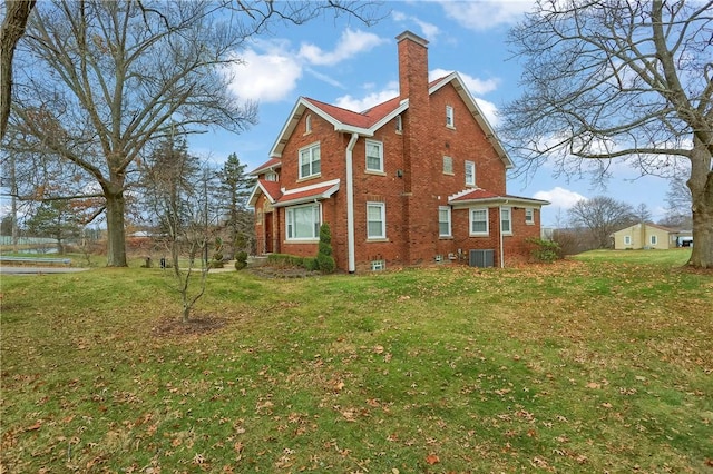 view of home's exterior with a yard and cooling unit