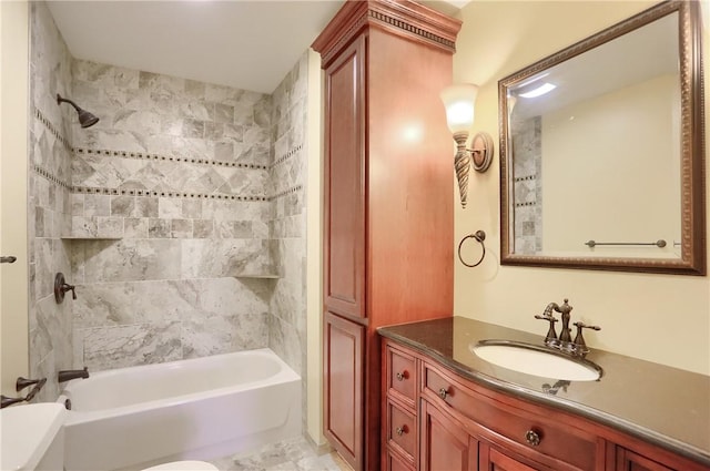 bathroom with vanity and tiled shower / bath combo