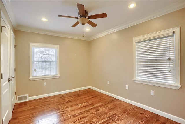 unfurnished room featuring ceiling fan, hardwood / wood-style floors, and ornamental molding