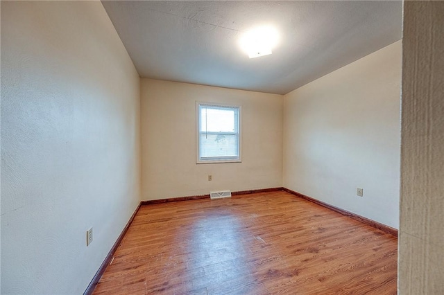 unfurnished room featuring light wood-type flooring