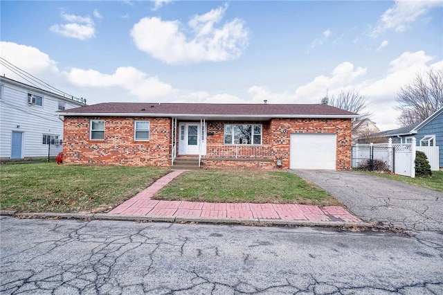 single story home with a front yard and a garage