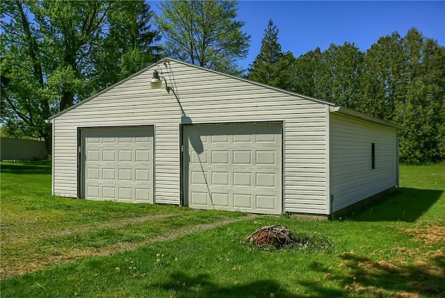 garage with a yard