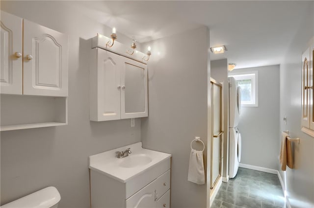 bathroom with vanity, toilet, and an enclosed shower