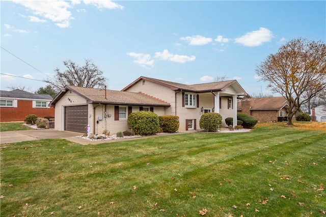 view of front of property with a garage and a front lawn