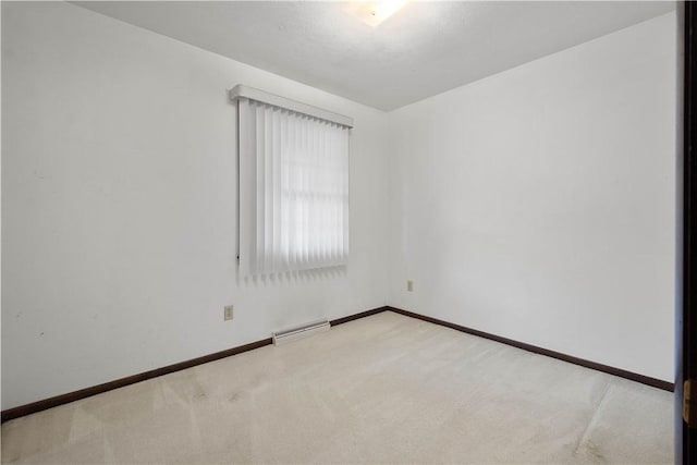 empty room featuring light colored carpet