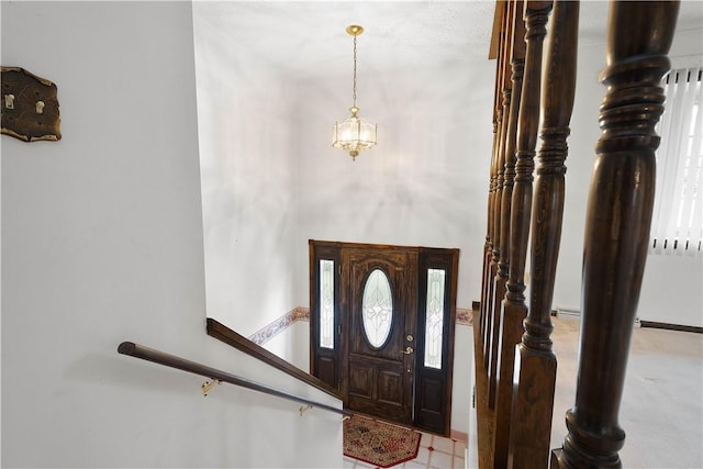 entrance foyer with a chandelier