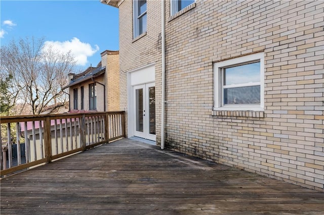 wooden deck featuring french doors