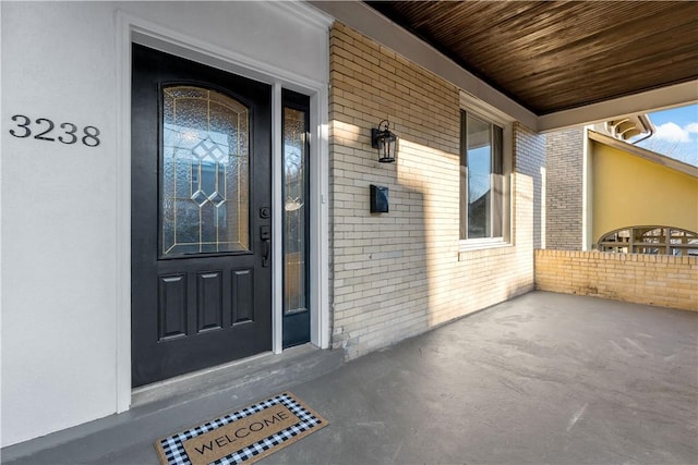 doorway to property with a porch