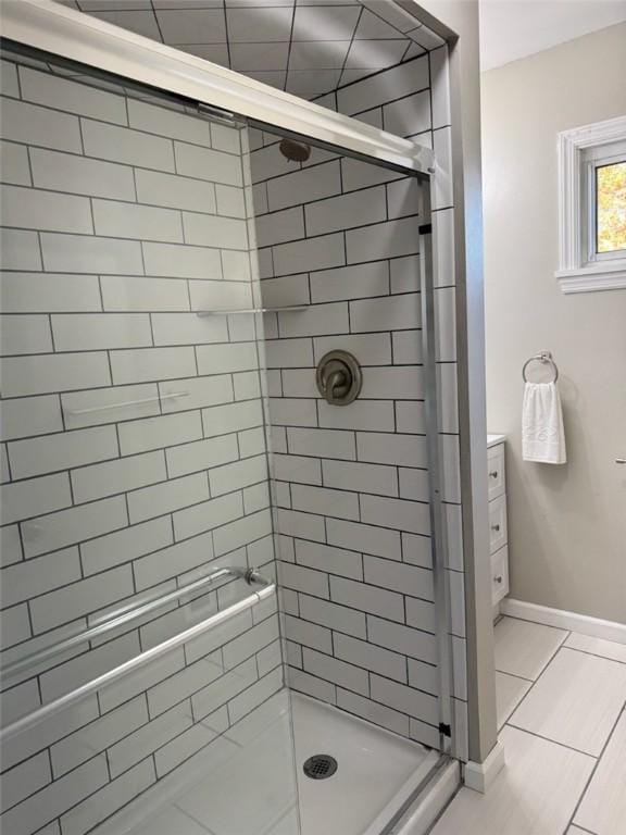 bathroom featuring tile patterned flooring and walk in shower