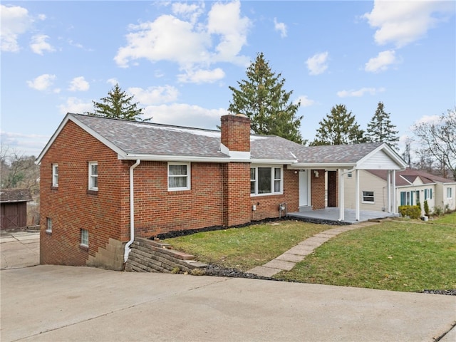 727 Scenery Dr, Elizabeth Twp/Boro, PA 15037 - ranch-style house featuring brick siding, a chimney, a front lawn, and a shingled roof