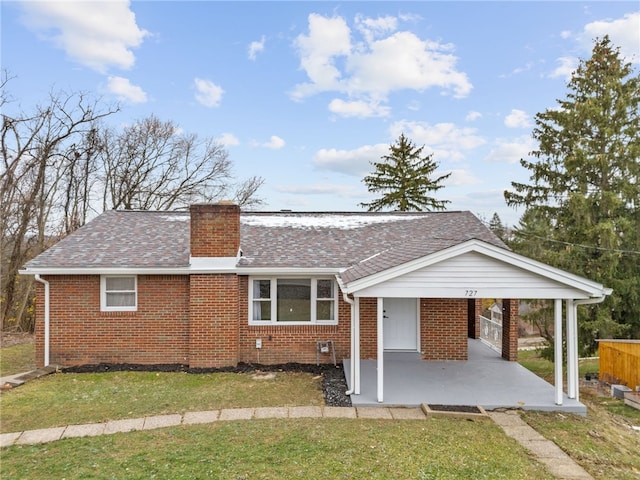 727 Scenery Dr, Elizabeth Twp/Boro, PA 15037 - view of front facade featuring brick siding, a chimney, a front yard, and roof with shingles