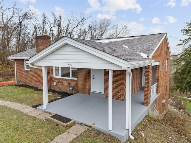 727 Scenery Dr, Elizabeth Twp/Boro, PA 15037 - rear view of property with roof with shingles, brick siding, a chimney, a patio area, and a yard