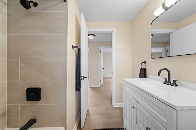 727 Scenery Dr, Elizabeth Twp/Boro, PA 15037 - full bath featuring tiled shower, vanity, and wood finished floors