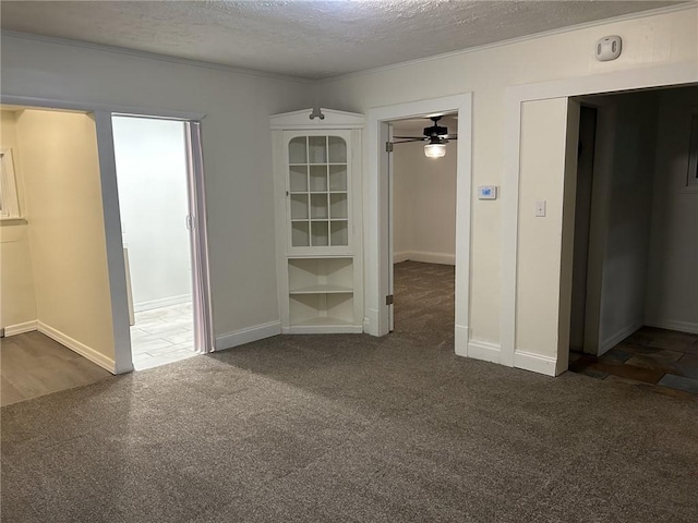 spare room featuring ceiling fan and a textured ceiling