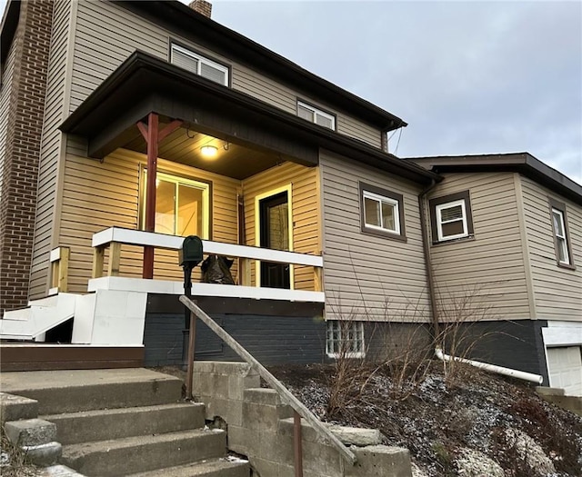 view of property exterior with a porch