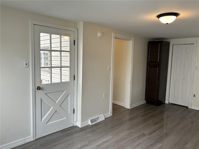 entryway with hardwood / wood-style flooring