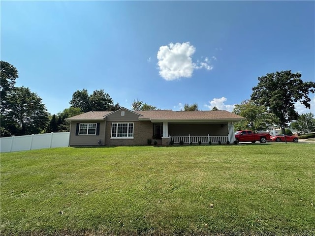 single story home featuring a front yard