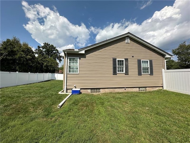 view of home's exterior with a yard