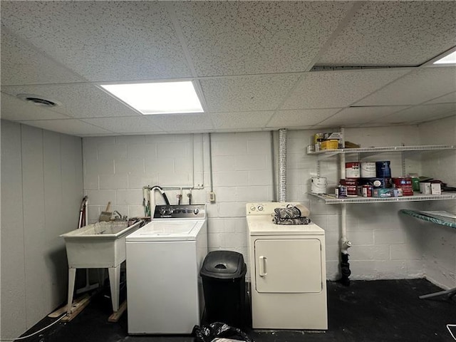 washroom featuring separate washer and dryer and sink