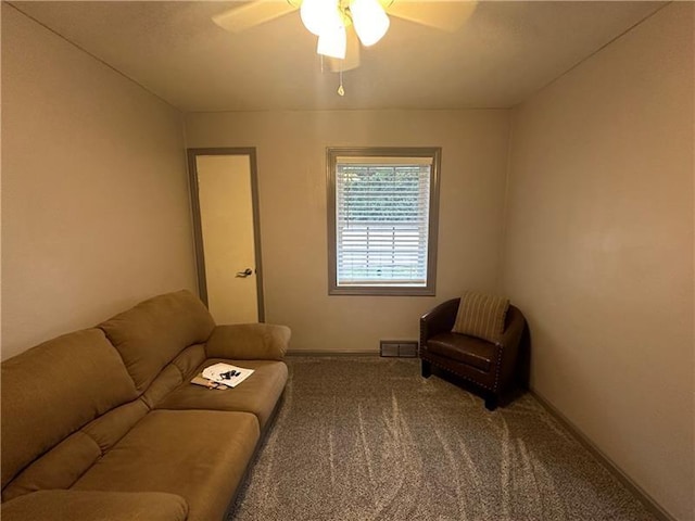 living room with carpet and ceiling fan