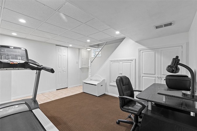 office featuring a paneled ceiling and light tile patterned flooring