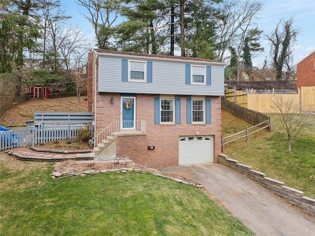 view of front of house with a garage and a front lawn