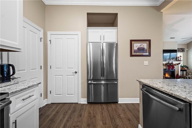 kitchen with white cabinetry, stainless steel appliances, and dark hardwood / wood-style floors