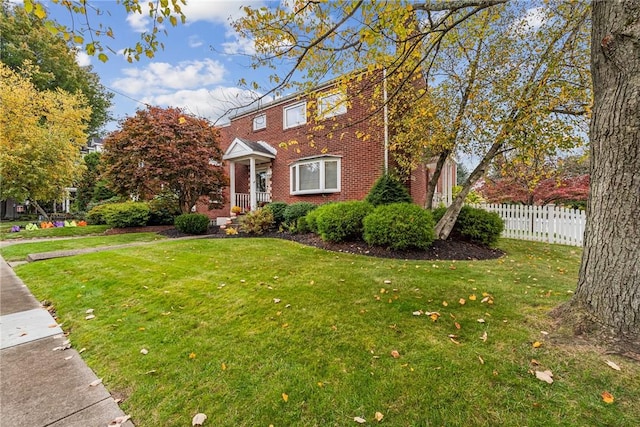 view of front of home with a front lawn